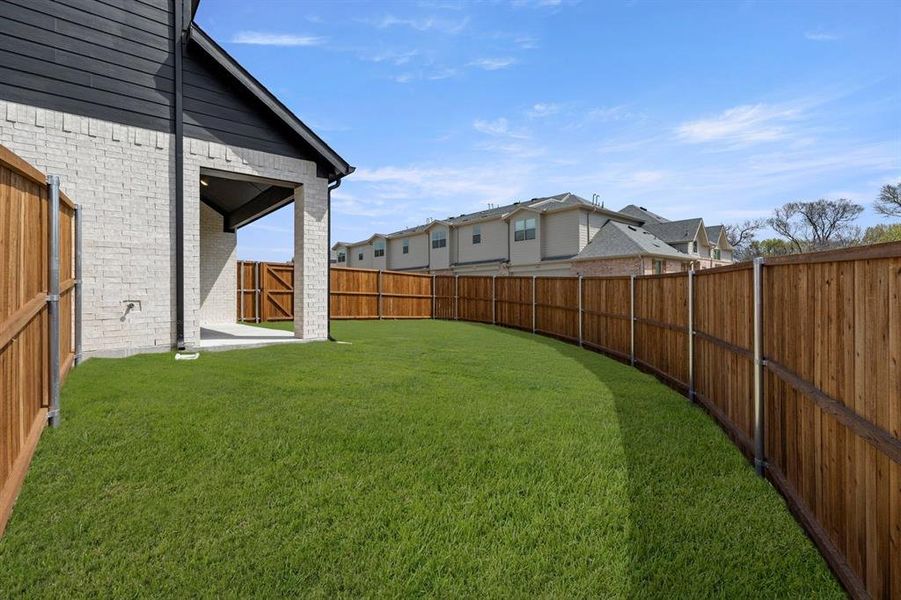 Exterior details and patio area of a home in Trails at Cottonwood Creek, Rowlett (Image 3).