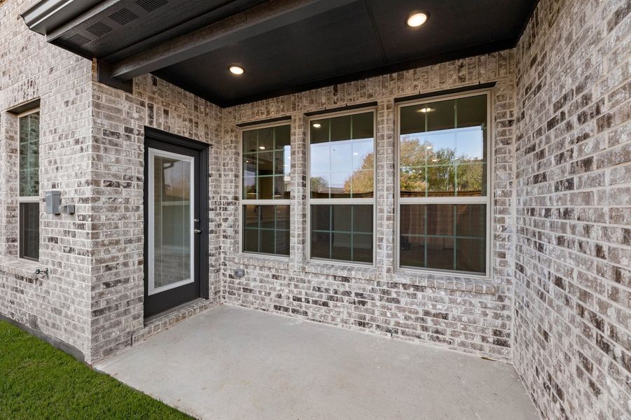 Front exterior of a new home in Main Street Village, Mansfield, TX, highlighting curb appeal (Image 28). Front exterior of a new home in Main Street Village, Mansfield, TX, highlighting curb appeal (Image 28).