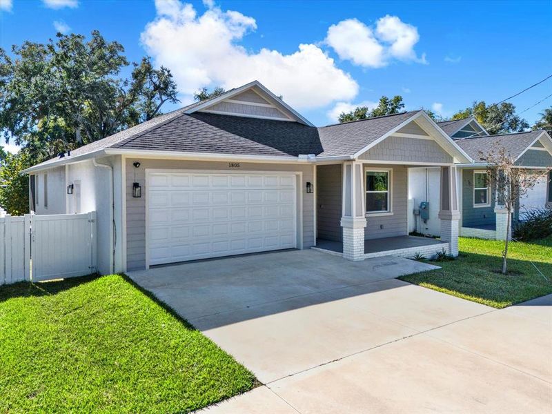 Front exterior of a new home in , Tampa, FL, highlighting curb appeal (Image 22).