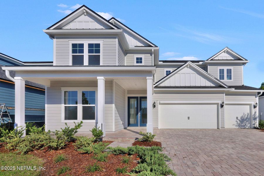 Exterior details and patio area of a home in The Landings at Saint Johns, St. Johns (Image 18).