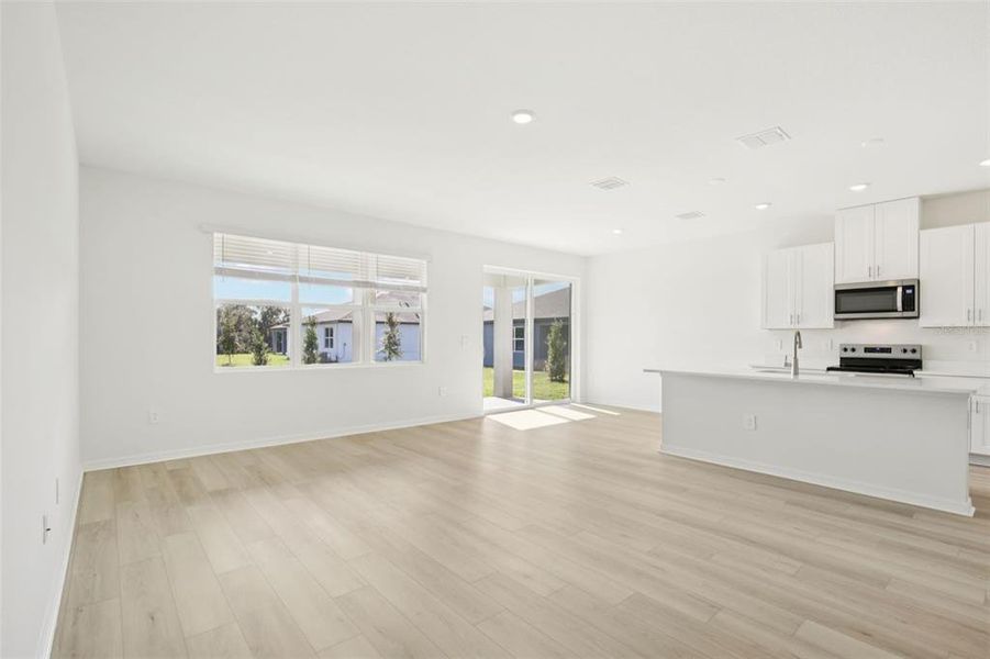 Spacious, unfurnished interior of a new home in Coasterra - Reserve Series, Palmetto (Image 35).