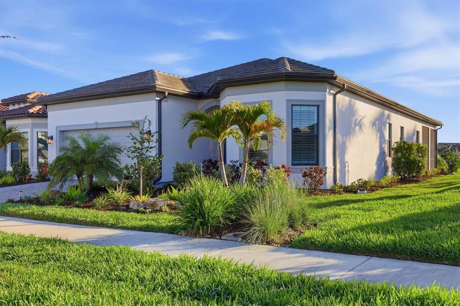Front exterior of a new home in , Nokomis, FL, highlighting curb appeal (Image 23). Front exterior of a new home in , Nokomis, FL, highlighting curb appeal (Image 23).
