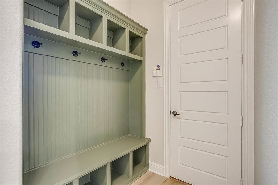 Mudroom with light wood-type flooring