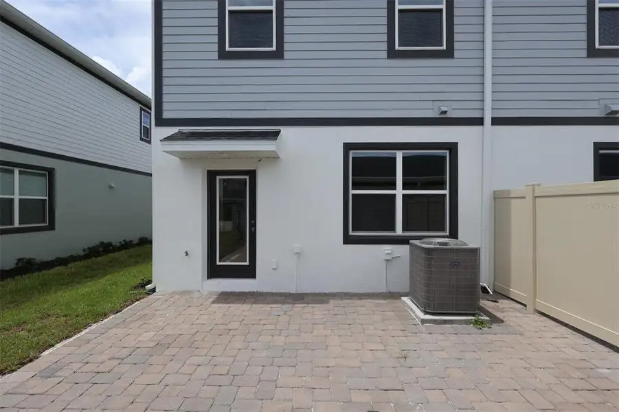 Exterior details and patio area of a home in Center Lake on the Park, St. Cloud (Image 3).