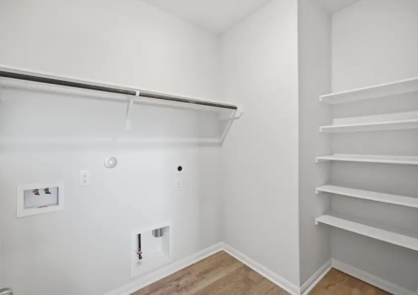 Laundry room with washer and dryer hookups in Montgomery floor plan