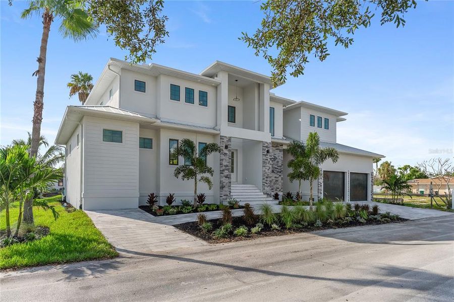 Front exterior of a new home in , Longboat Key, FL, highlighting curb appeal (Image 30). Front exterior of a new home in , Longboat Key, FL, highlighting curb appeal (Image 30).