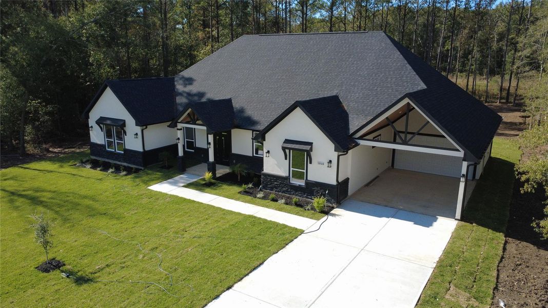 Front exterior of a new home in , Dayton, TX, highlighting curb appeal (Image 26). Front exterior of a new home in , Dayton, TX, highlighting curb appeal (Image 26).
