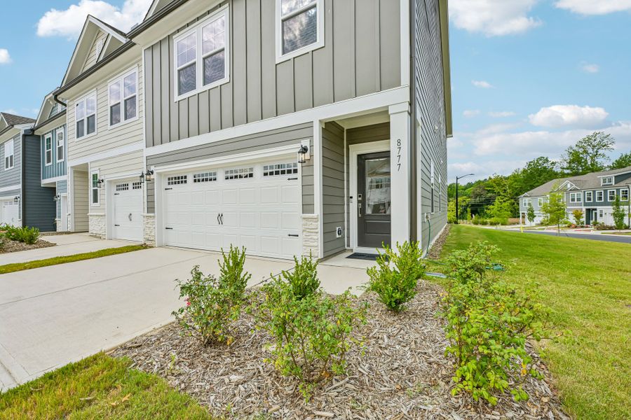 Exterior details and patio area of a home in Forestville Station, Wake Forest (Image 20).