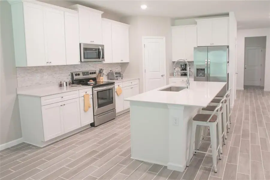 Furnished interior view inside a new home in , Gainesville (Image 6).