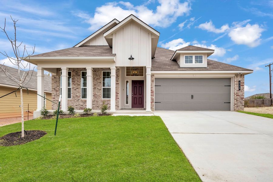 Front exterior of a new home in The Village at Elm Creek, Troy, TX, highlighting curb appeal (Image 1). Front exterior of a new home in The Village at Elm Creek, Troy, TX, highlighting curb appeal (Image 1).
