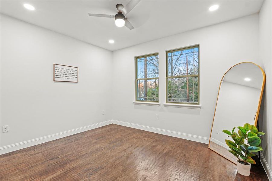 Unfurnished room featuring recessed lighting, a ceiling fan, and dark wood finished floors