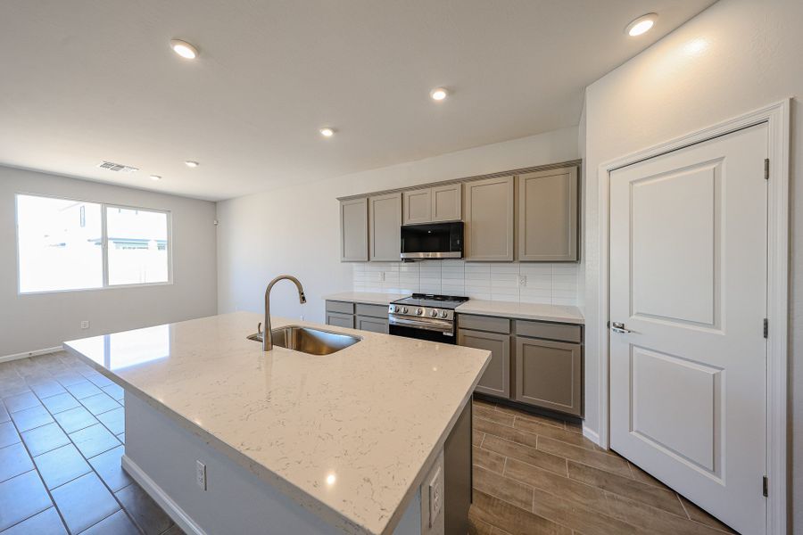 A kitchen with white cabinets. A kitchen with white cabinets.