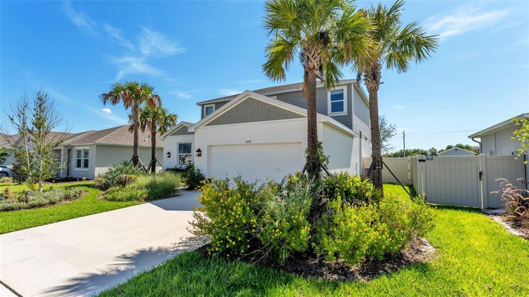 Front exterior of a new home in , Auburndale, FL, highlighting curb appeal (Image 25). Front exterior of a new home in , Auburndale, FL, highlighting curb appeal (Image 25).