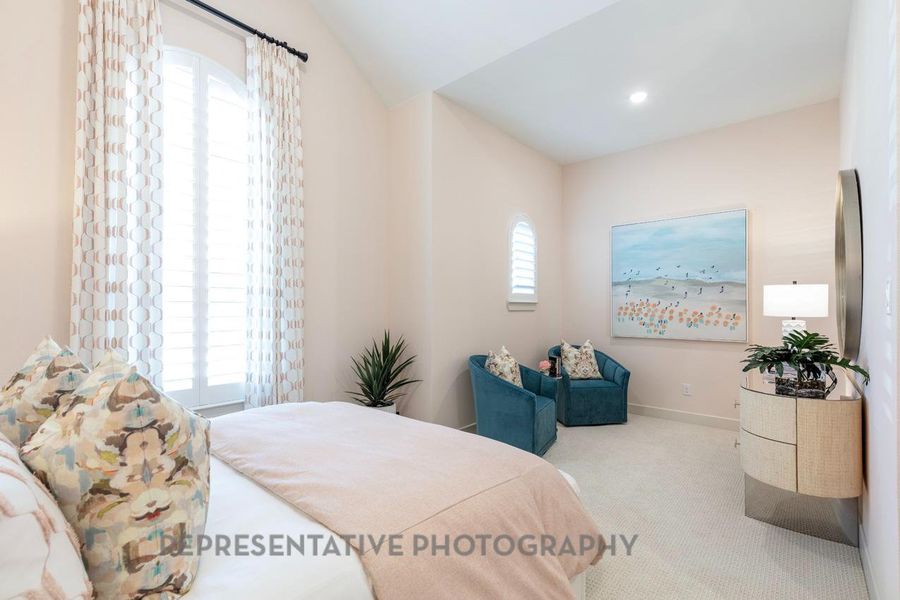 Carpeted bedroom with baseboards and recessed lighting