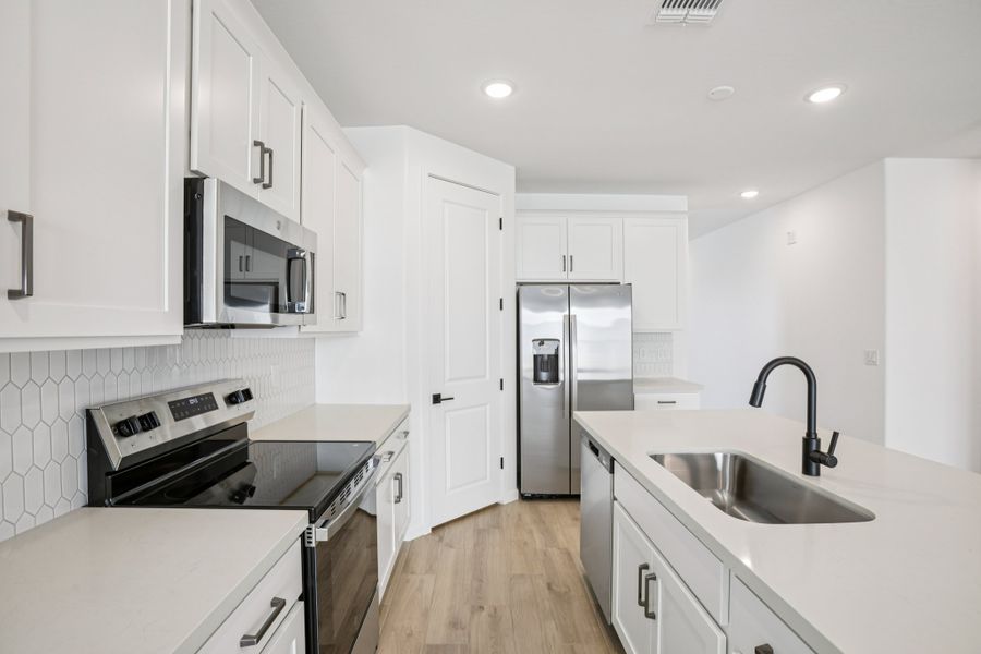 Kitchen featuring the Harmony Collection. Finishes and options may vary by community