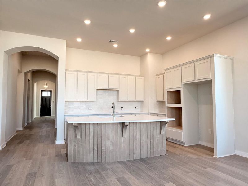Gorgeous kitchen with quartz countertops.