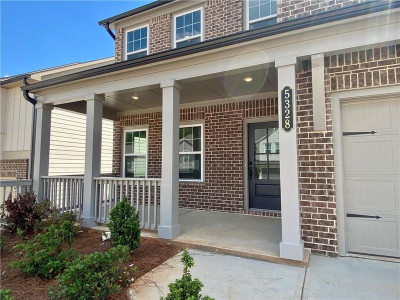 Exterior details and patio area of a home in Eastlyn Crossing, Flowery Branch (Image 3).