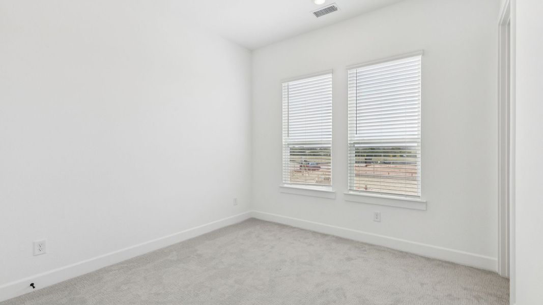 Representative unfurnished interior of a home built from the Elise by Normandy Homes in Rainwater Crossing, Celina (Image 13).
