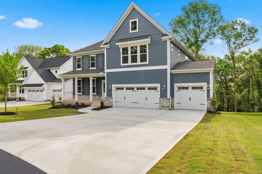 Front exterior of a new home in Timberland Grove, Anderson, SC, highlighting curb appeal (Image 2). Front exterior of a new home in Timberland Grove, Anderson, SC, highlighting curb appeal (Image 2).