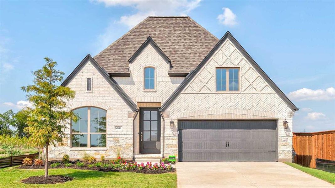 Front exterior of a new home in Trinity Falls 50', McKinney, TX, highlighting curb appeal (Image 16).