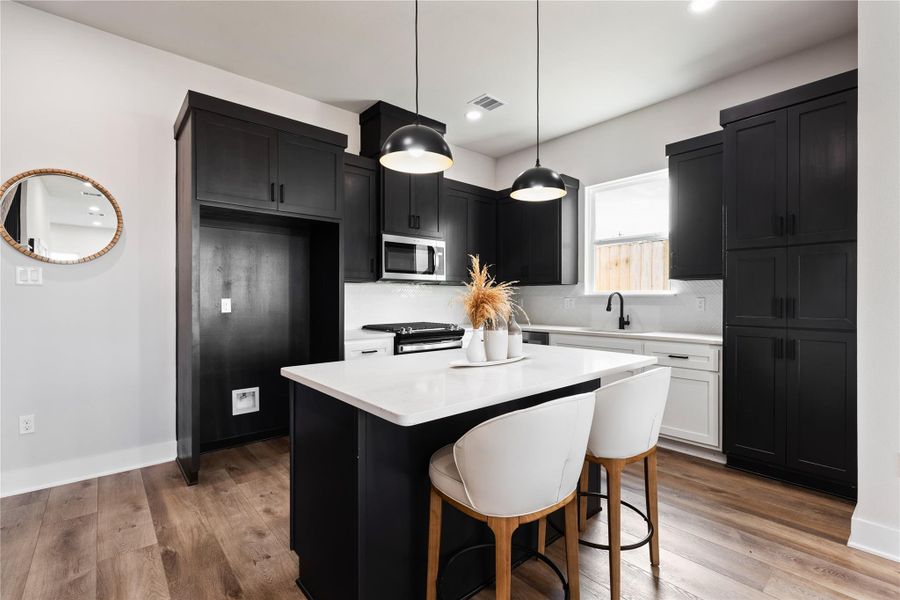 A spacious, light-filled kitchen offers a perfect blend of modern design and everyday practicality. With an open layout and crisp finishes, it’s a space that invites connection, comfort, and effortless entertaining.