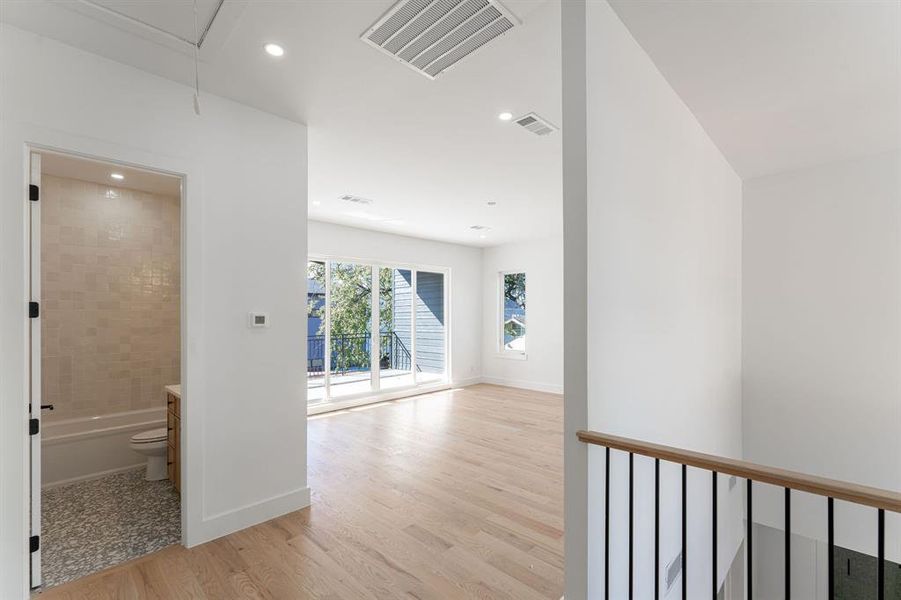 Hallway featuring light hardwood / wood-style floors