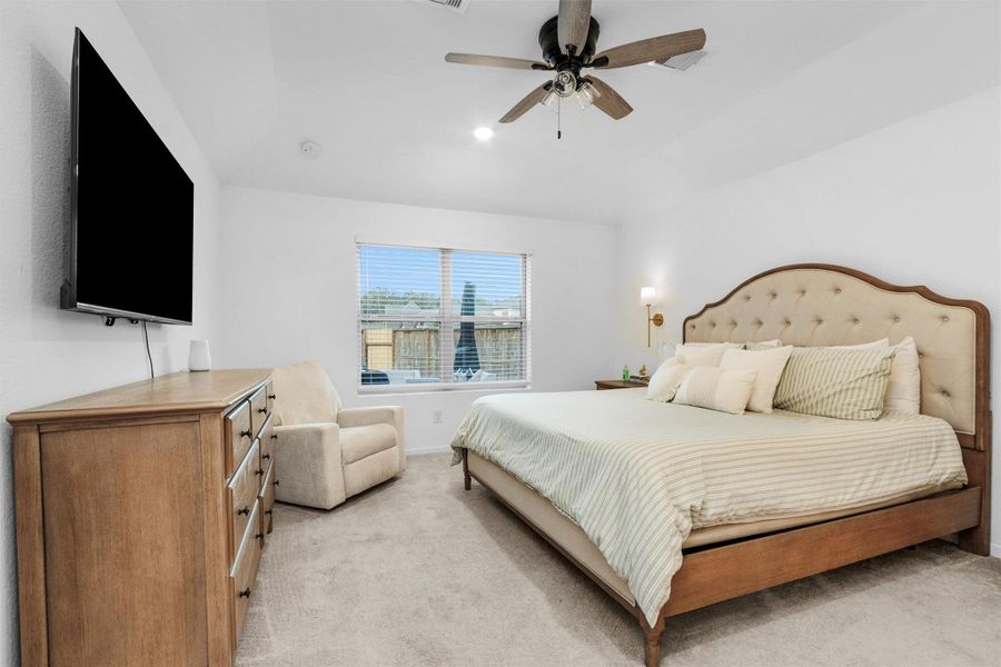 Primary bedroom at the back of the home