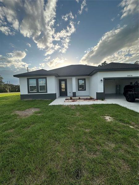 Front exterior of a new home in , Ocala, FL, highlighting curb appeal (Image 13).