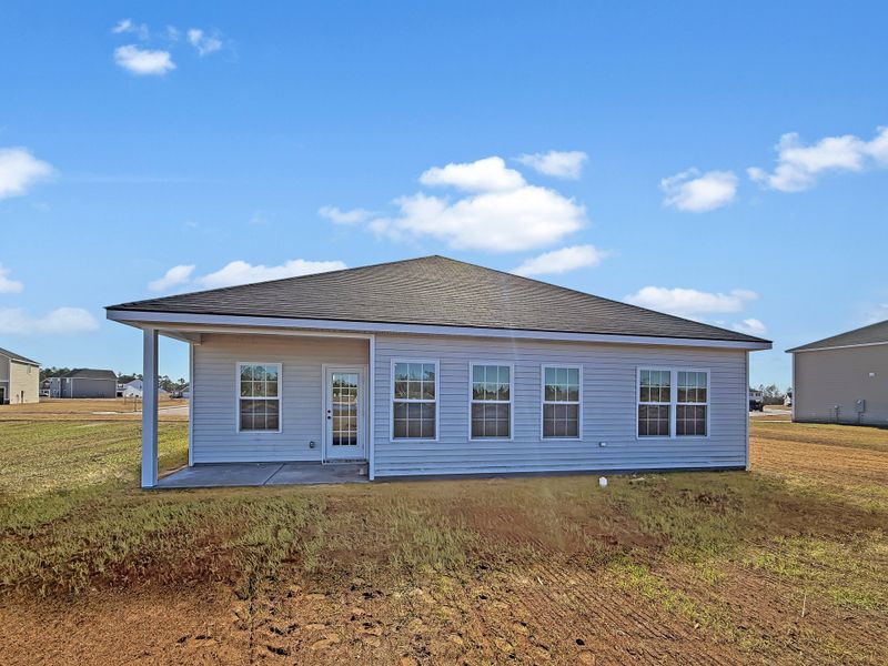 Exterior details and patio area of a home in The Village at Sassafras, Allenhurst (Image 3).
