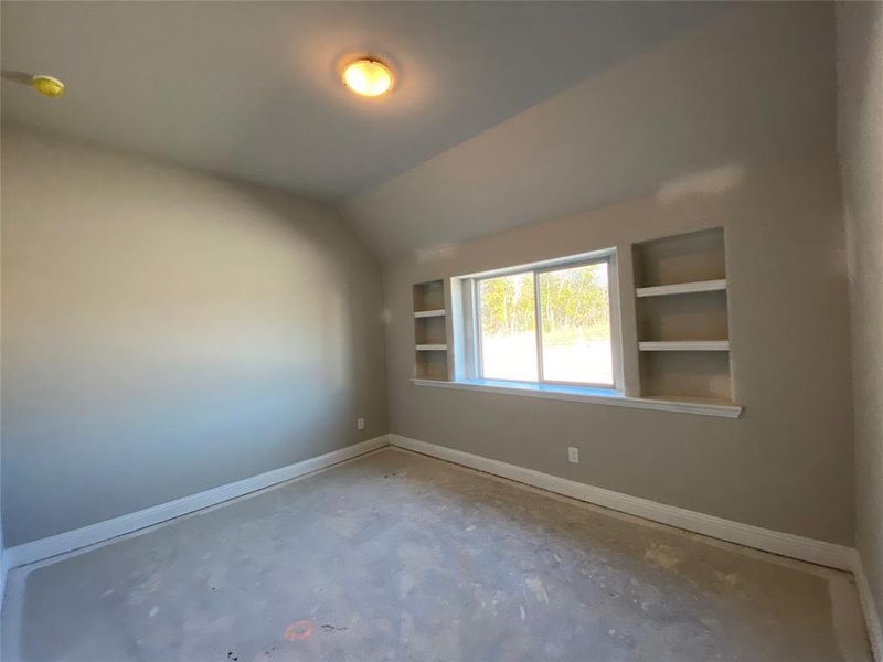 Bed 2 with vaulted ceiling & built-in shelves (light greige carpet not installed yet) Bed 2 with vaulted ceiling & built-in shelves (light greige carpet not installed yet)