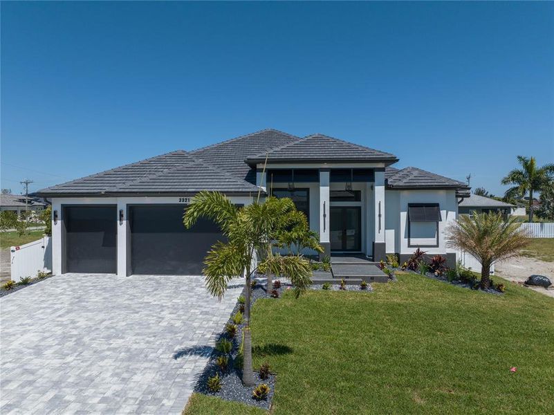 Front exterior of a new home in , Cape Coral, FL, highlighting curb appeal (Image 26).