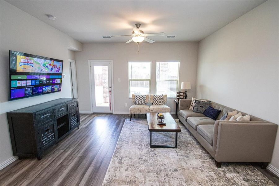 Living area with wood finished floors and ceiling fan Living area with wood finished floors and ceiling fan