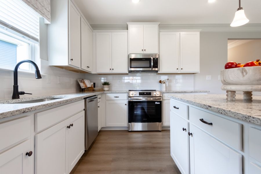 Bradley F with Bonus at Cobblestone Crossing Commons | Kitchen Sink, Window, and Island Bradley F with Bonus at Cobblestone Crossing Commons | Kitchen Sink, Window, and Island