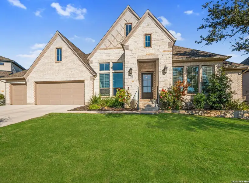 Front exterior of a new home in The Ranches at Creekside, Boerne, TX, highlighting curb appeal (Image 2). Front exterior of a new home in The Ranches at Creekside, Boerne, TX, highlighting curb appeal (Image 2).