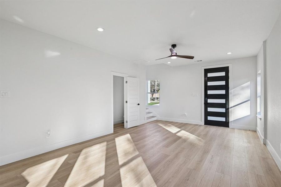 Entrance foyer with recessed lighting, light wood-style floors, and a ceiling fan