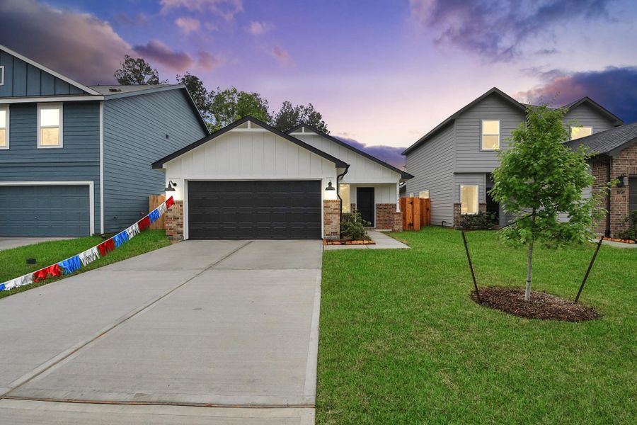Front exterior of a new home in The Enclave at Spring Branch, Montgomery, TX, highlighting curb appeal (Image 2). Front exterior of a new home in The Enclave at Spring Branch, Montgomery, TX, highlighting curb appeal (Image 2).