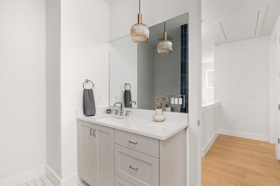 Bathroom with vanity and baseboards