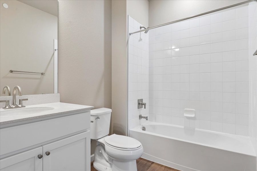 A bathroom with a toilet and sink.