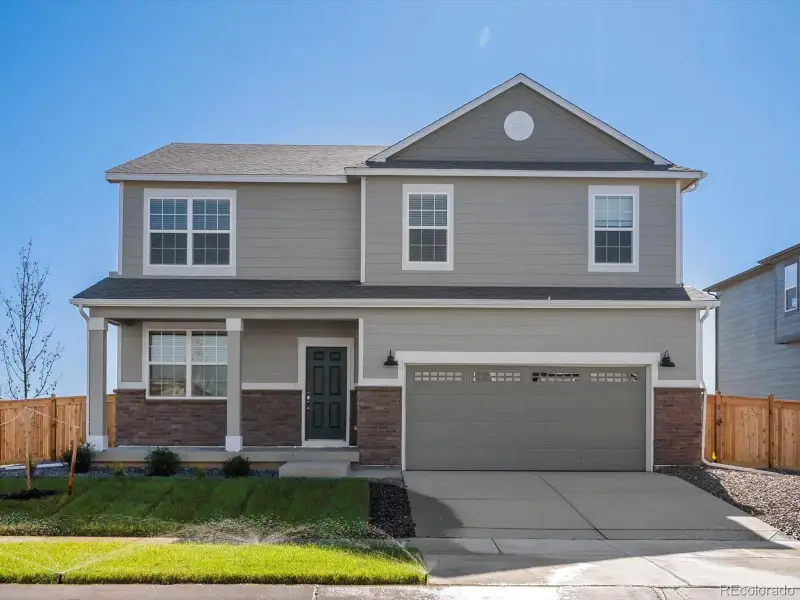 Front exterior of a new home in , Commerce City, CO, highlighting curb appeal (Image 1). Front exterior of a new home in , Commerce City, CO, highlighting curb appeal (Image 1).