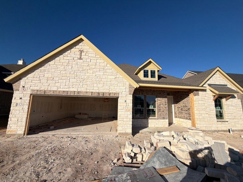 In-progress construction of a new home in Covenant Springs, Springtown, TX (Image 3).
