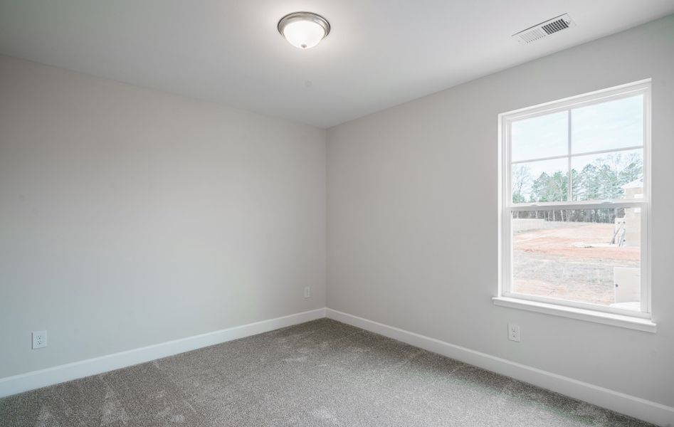 Representative unfurnished interior of a home built from the The McKee Manor by Cothran Homes in Holly Ridge, Greenville (Image 35). Representative unfurnished interior of a home built from the The McKee Manor by Cothran Homes in Holly Ridge, Greenville (Image 35).