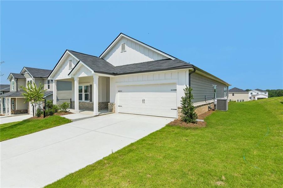 Front exterior of a new home in Preserve at Mountain Creek, Pendergrass, GA, highlighting curb appeal (Image 26). Front exterior of a new home in Preserve at Mountain Creek, Pendergrass, GA, highlighting curb appeal (Image 26).