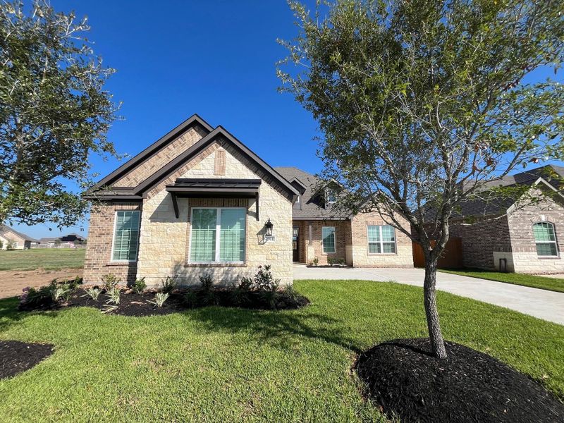 Front exterior of a new home in Sierra Vista, Iowa Colony, TX, highlighting curb appeal (Image 1). Front exterior of a new home in Sierra Vista, Iowa Colony, TX, highlighting curb appeal (Image 1).