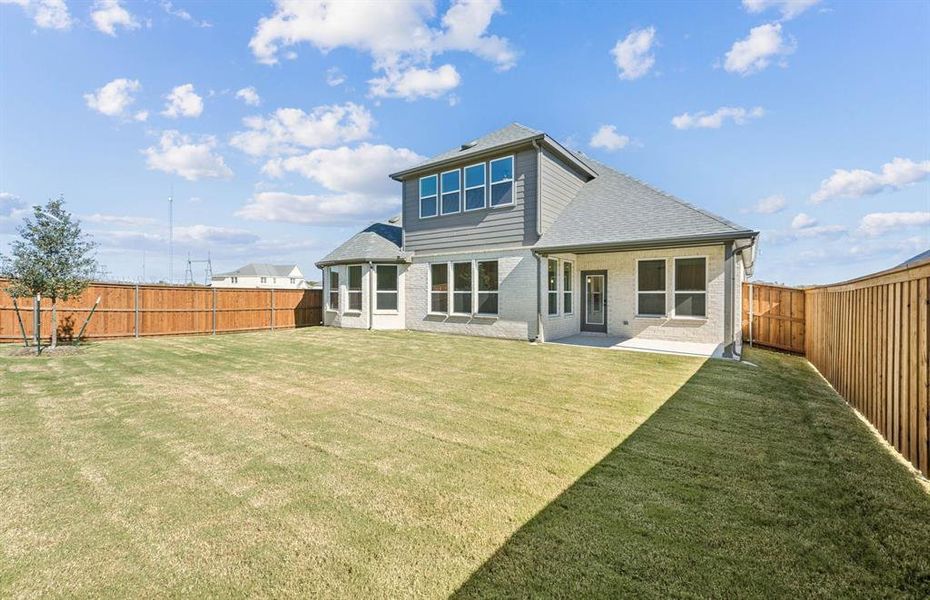 Covered patio offers ample space for entertaining or relaxing Covered patio offers ample space for entertaining or relaxing