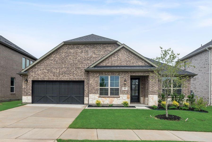 Front exterior of a new home in Sutton Fields, Celina, TX, highlighting curb appeal (Image 20). Front exterior of a new home in Sutton Fields, Celina, TX, highlighting curb appeal (Image 20).