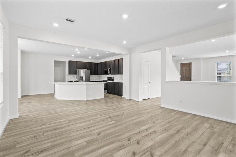 A gorgeous view from the Family Room into the kitchen.