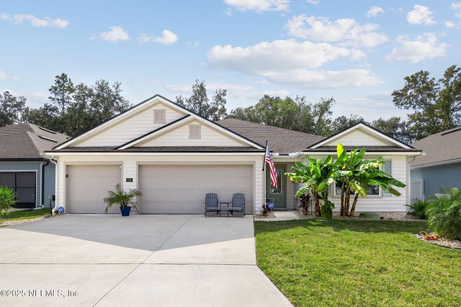 Front exterior of a new home in Pecan Ridge, Jacksonville, FL, highlighting curb appeal (Image 1).