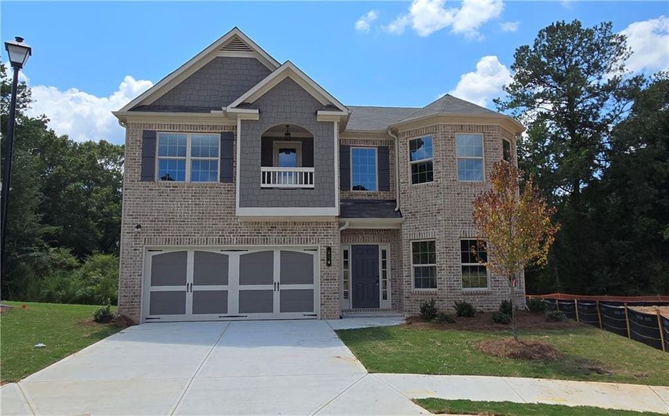 Front exterior of a new home in , Grayson, GA, highlighting curb appeal (Image 1).