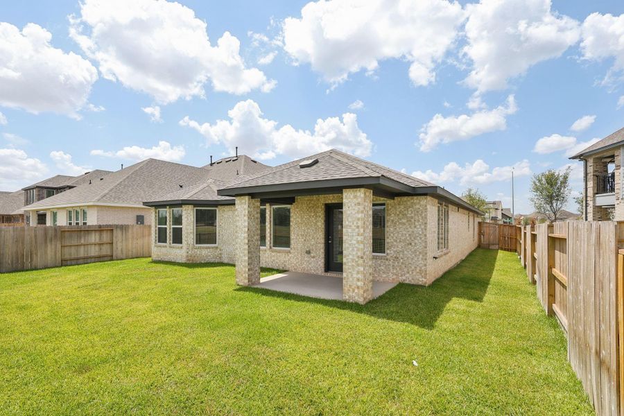 Front exterior of a new home in Kingdom Heights, Rosenberg, TX, highlighting curb appeal (Image 24). Front exterior of a new home in Kingdom Heights, Rosenberg, TX, highlighting curb appeal (Image 24).