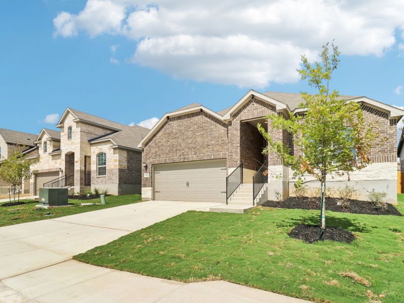 Front exterior of a new home in Sagebrooke - Classic Series, San Antonio, TX, highlighting curb appeal (Image 21). Front exterior of a new home in Sagebrooke - Classic Series, San Antonio, TX, highlighting curb appeal (Image 21).